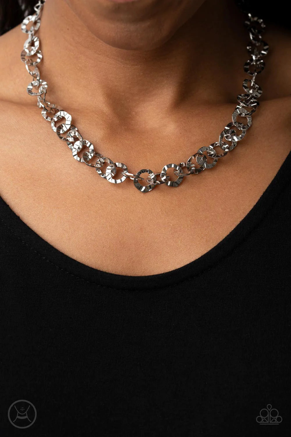 Paparazzi Accessories Rebel Grit - Silver Crinkled silver rings boldly link around the neck, resulting in a gritty industrial fashion. Features an adjustable clasp closure. Sold as one individual choker necklace. Includes one pair of matching earrings.