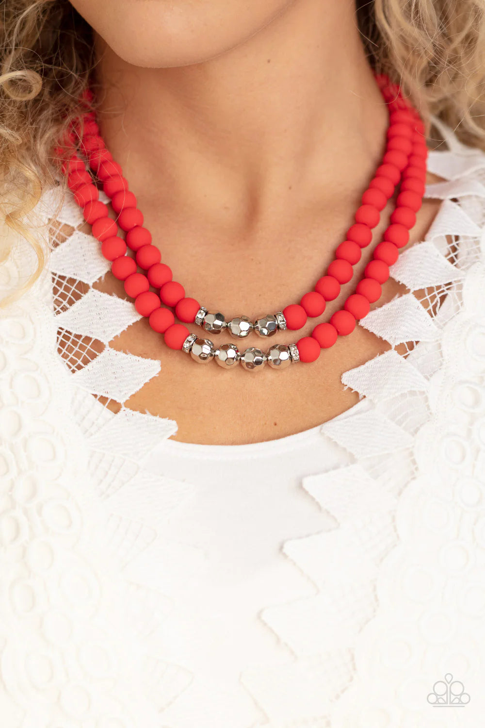 Paparazzi Accessories Summer Splash - Red Threaded along invisible wires, matte-finished Poinciana beads give way to center sections of white rhinestone encrusted rings and faceted silver beads. The vivacious display layers below the collar, creating a su