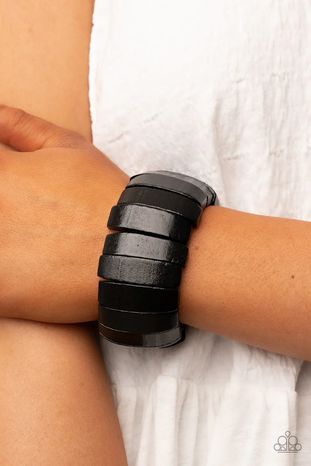 Paparazzi Accessories Boardwalk Bonanza - Black Smooth black wooden panels are threaded along stretchy bands to create a tropical vibe as they fall around the wrist. Sold as one individual bracelet. Jewelry