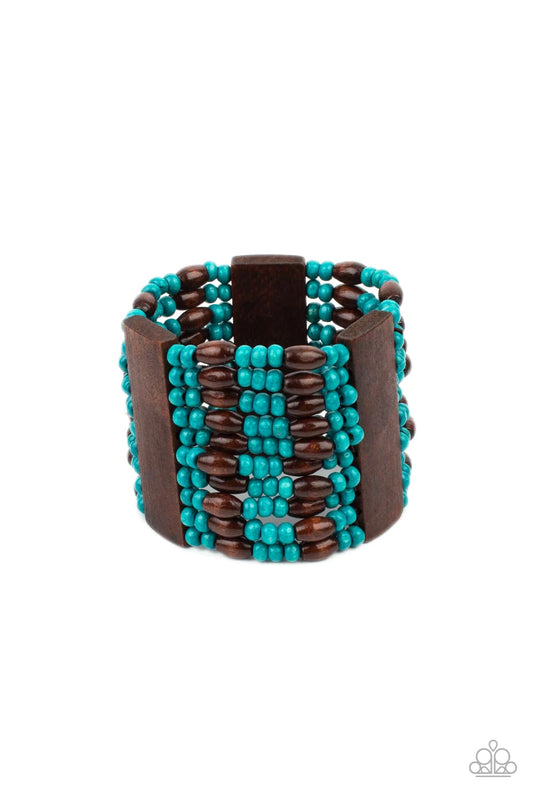 Paparazzi Accessories Tropical Takeover - Blue Stacked layers of bright turquoise and brown wooden beads are threaded along stretchy bands and wrap around the wrist in a linear pattern. Three wide wooden bars interrupt the pattern, adding weight to the tr