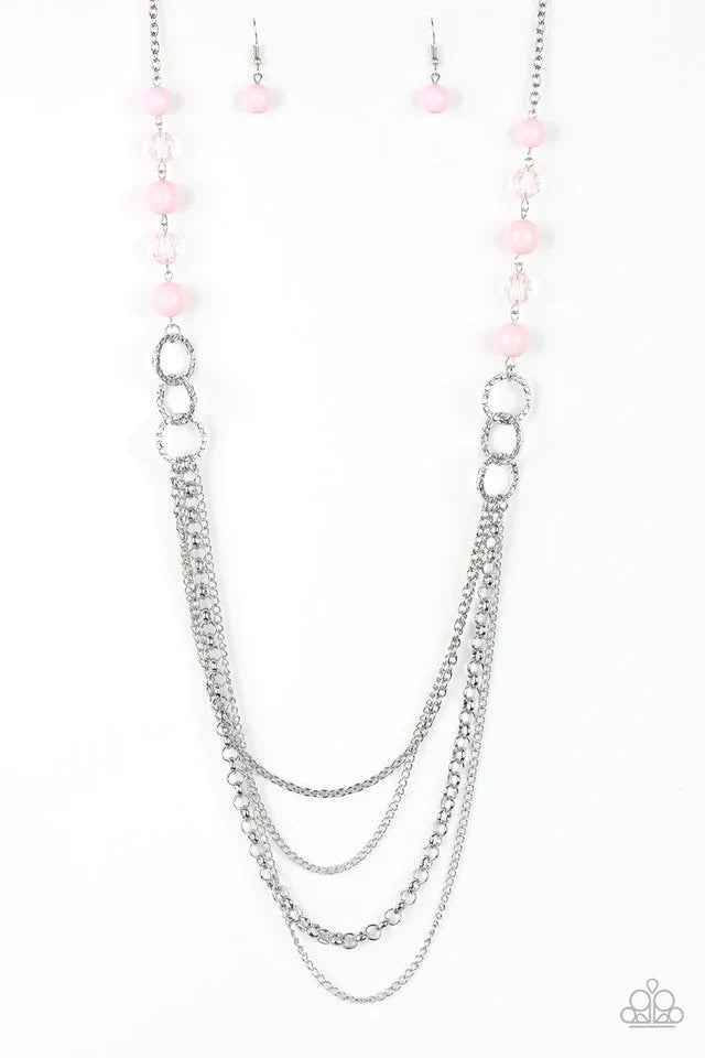 Paparazzi Accessories Vividly Vivid - Pink Polished pink, faceted crystal-like and delicately hammered silver hoops give way to mismatched silver chains down the chest for a whimsical look. Features an adjustable clasp closure.