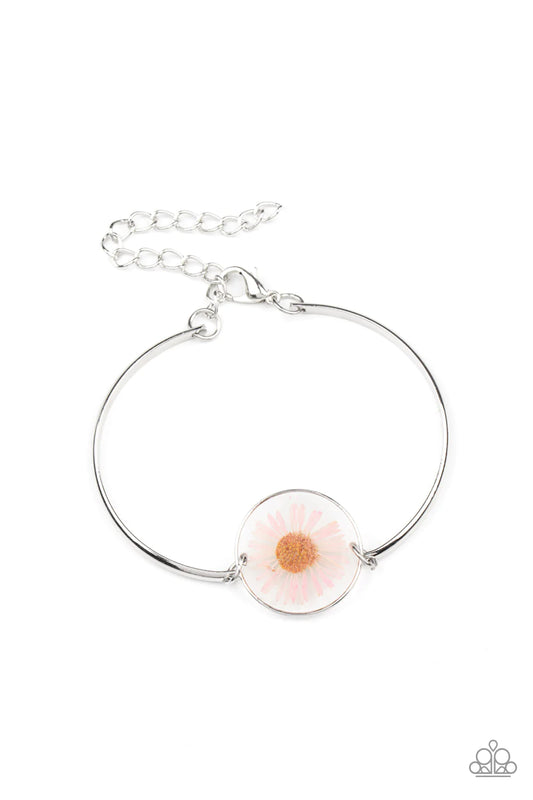 Paparazzi Accessories Cottage Season - Pink Encased in a glassy fitting, a whimsical pink daisy centerpiece attaches to two arcing silver bars around the wrist for an enchanting floral look. Features an adjustable clasp closure. Sold as one individual bra