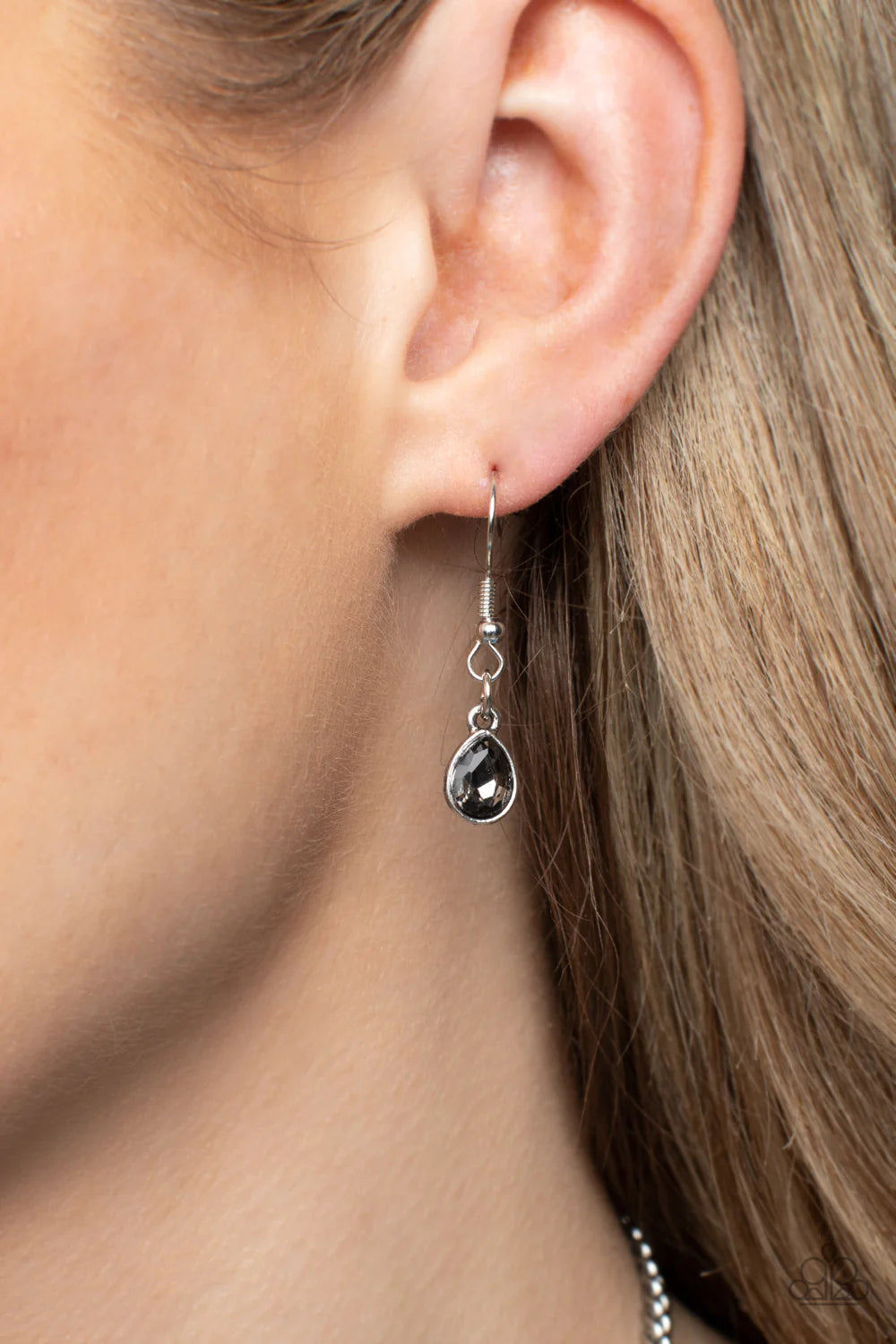 Paparazzi Accessories Formally Forged - Silver Delicately hammered in shimmer, a collection of shiny silver teardrops link below the collar for an edgy statement-making look. Set in each hammered frame, faceted, smoky teardrop gems add a dramatic pop of c