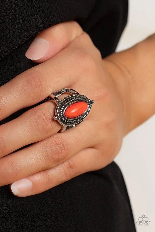 Paparazzi Accessories Mojave Metro - Orange An oblong burnt orange stone adorns the center of a ring of spun rope-like silver inside of a textured and studded silver frame, creating a colorful artisanal centerpiece atop the finger. Features a stretchy ban