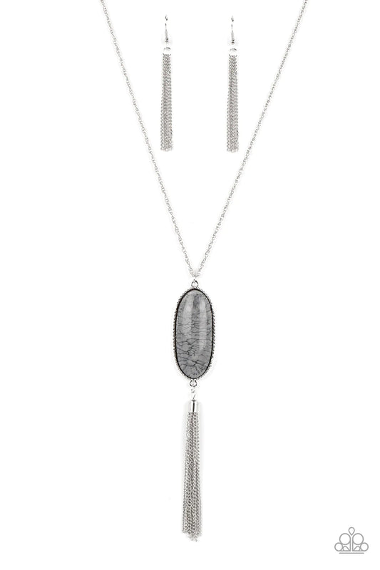 Paparazzi Accessories Southern Stroll - Silver Shimmery Northern Droplet lacquer-like paint swirls into a faux stone pattern inside of a glassy casing. The oblong pendant glides along a classic silver chain below the collar while a silver tassel dances fr