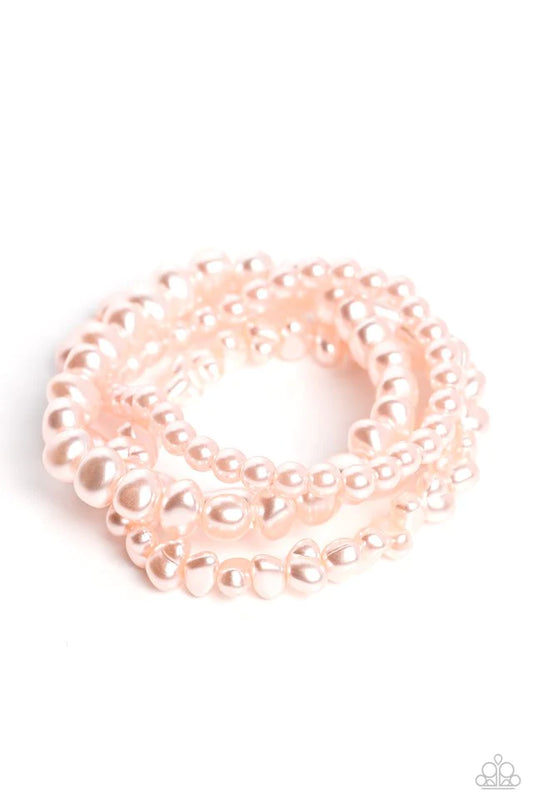 Paparazzi Accessories Gossip PEARL - Pink An abstract collection of geometric baby pink pearls coalesces around the wrist in four layers on elastic stretchy bands for a fashionably, refined stack. Sold as one set of four paparazzi bracelets. Jewelry