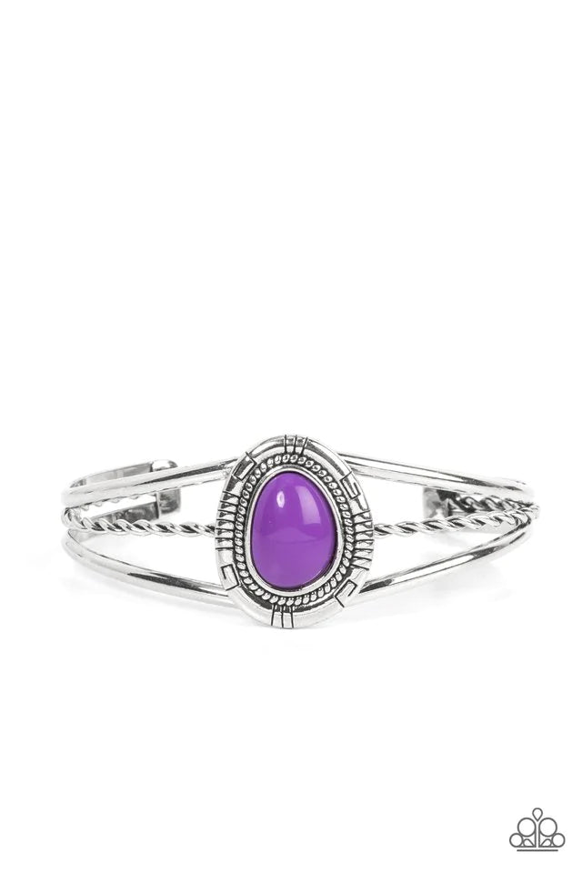 Paparazzi Accessories Ethereal Enthusiast - Purple An asymmetrical purple bead is encircled with a textured silver frame atop a decorative silver cuff, resulting in a colorful tribal inspired centerpiece around the wrist. Jewelry