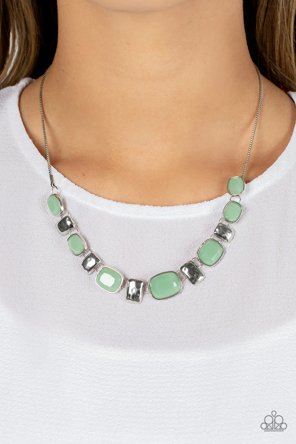 Paparazzi Accessories Polished Parade - Green Rounded rectangular beads in a vibrant Loden Frost hue are pressed into silver frames, showcasing their faceted surfaces as they crawl along the collar. Small silver, rectangular plates, hammered in subtle tex