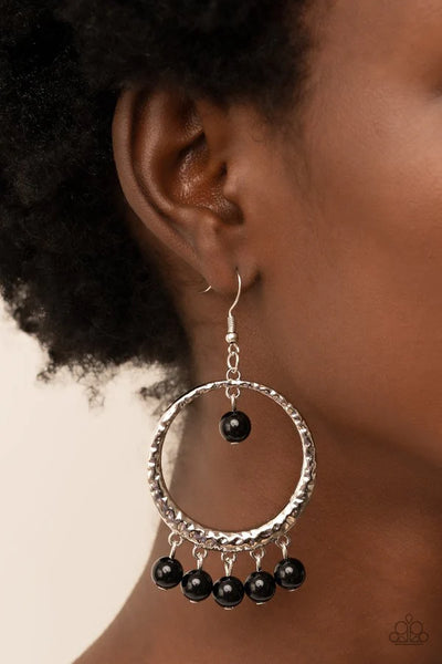 Paparazzi Accessories Luscious Luxury - Black A single black bead swings from the top of a hammered silver hoop. Matching black beads dance from the bottom of the hoop, creating a bubbly fringe. Earring attaches to a standard fishhook fitting. Jewelry