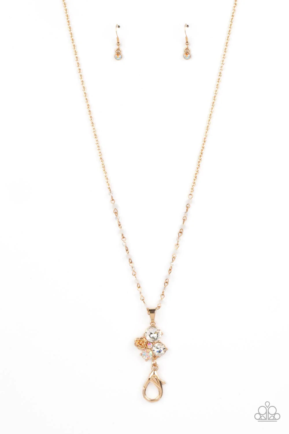 Paparazzi Accessories Rainbow Bloom - Gold *Lanyard Varying in size and shimmer, rhinestones brushed in an iridescent shimmer and glittery white rhinestones coalesce into a clustered pendant at the bottom of a shimmery gold chain. A metallic gold rose blo
