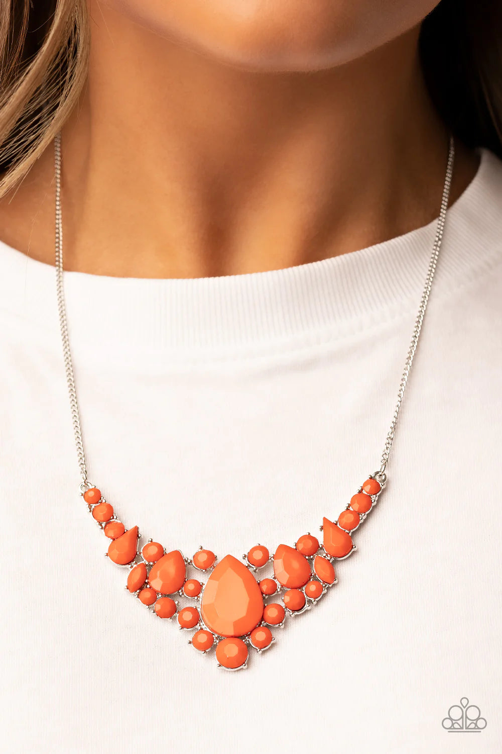 Paparazzi Accessories Bali Ballroom - Orange A faceted collection of round, teardrop, and marquise style orange beads coalesce around an oversized orange teardrop bead, resulting in a dramatic centerpiece below the collar. Features an adjustable clasp clo