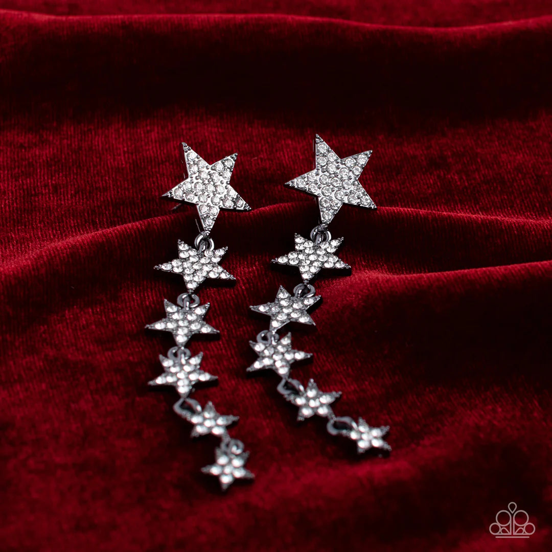 Paparazzi Accessories Americana Attitude - Black Dotted with dainty white rhinestones, a stellar collection of gunmetal stars decrease in size as they cascade from the ear for an out-of-this-world fashion. Earring attaches to a standard post fitting. Sold