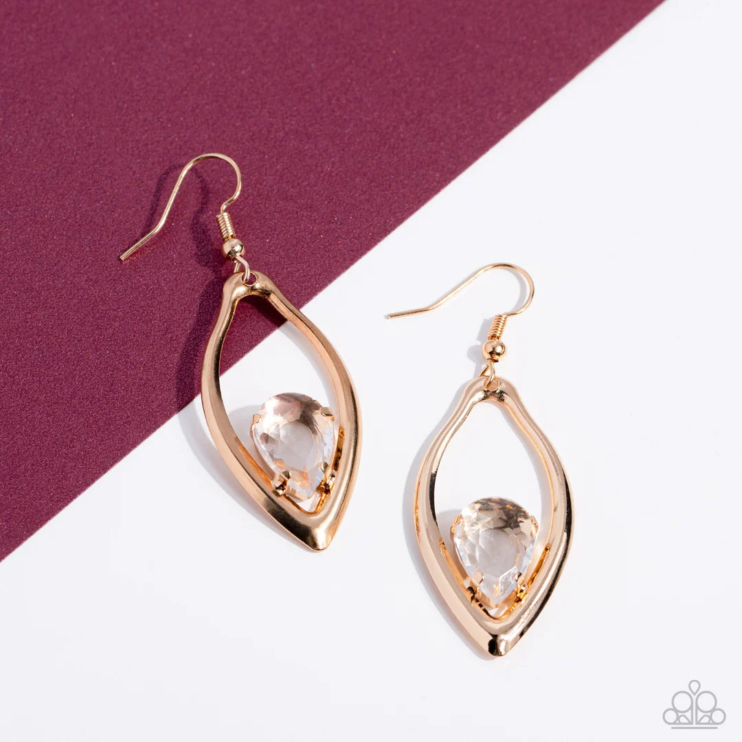 Paparazzi Accessories Beautifully Bejeweled - Gold A golden teardrop gem is nestled inside the bottom of a warped gold frame, culminating into an edgy sparkle. Earring attaches to a standard fishhook fitting. Sold as one pair of earrings. Jewelry