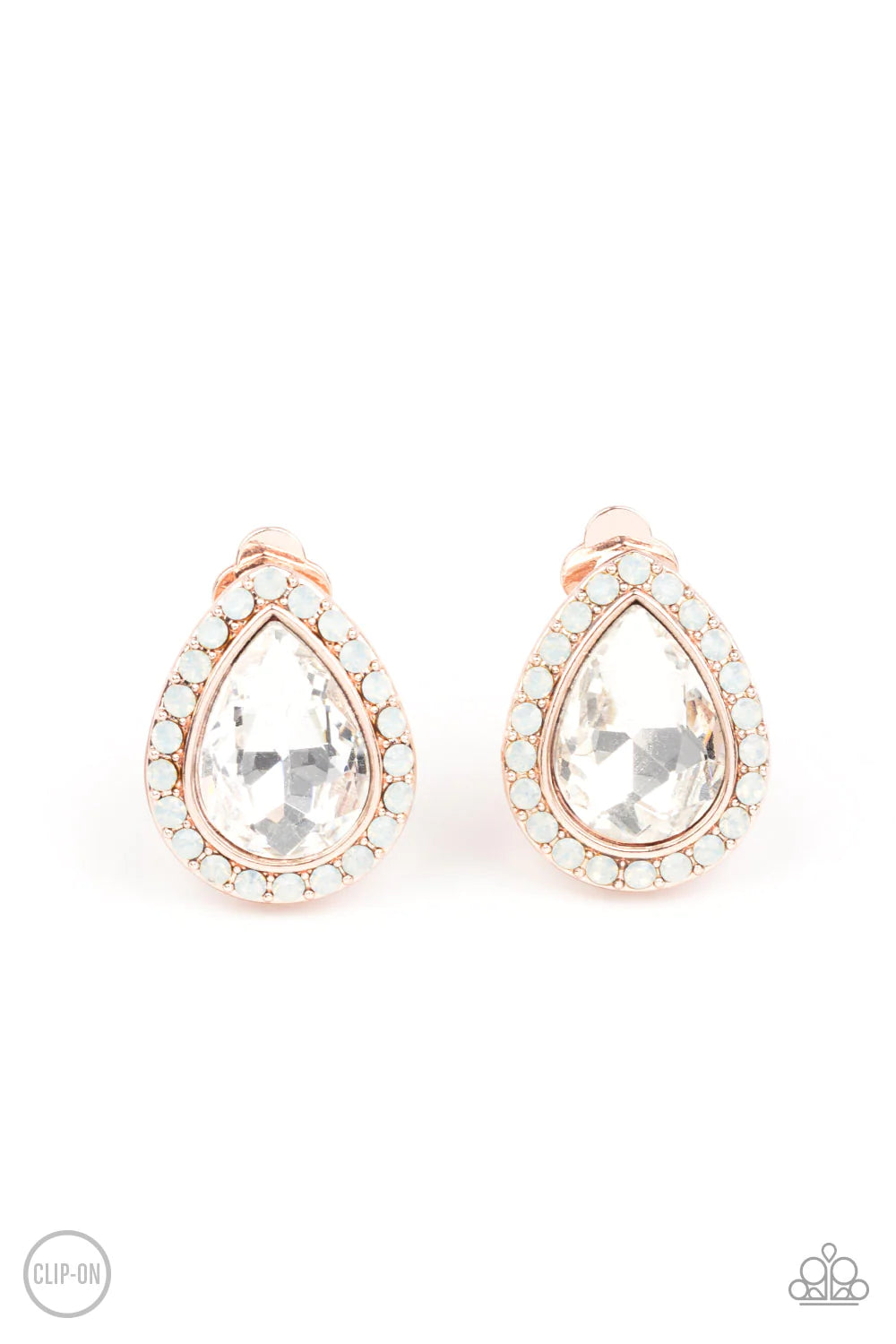 Paparazzi Accessories Cosmic Castles - Rose Gold *Clip-On A faceted white teardrop gem is pressed into a rose gold frame bordered with opalescent white rhinestones for a glamorous finish. Earring attaches to a standard clip-on fitting. Sold as one pair of