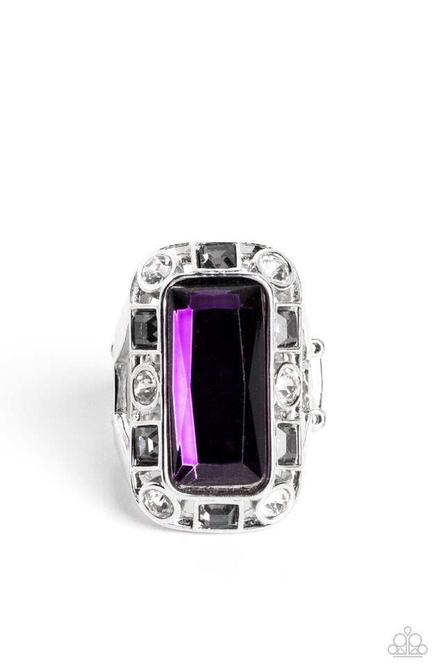 Paparazzi Accessories Radiant Rhinestones - Purple Pressed into a curved, rectangular silver frame, an oversized emerald-cut purple gem shines atop the finger. Dainty square and round gems in shades of white and smoky black airily encircle the oversized g