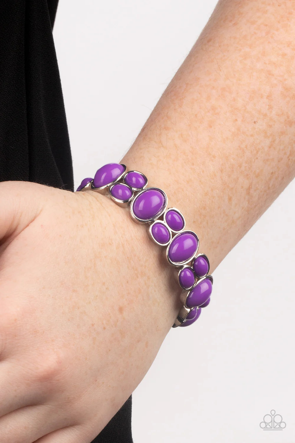 Paparazzi Accessories Tic Tac Dance - Purple Encased in shiny silver frames, stacks of purple oval beads alternate with oversized purple ovals along stretchy bands around the wrist for a posh pop of color. Sold as one individual bracelet.