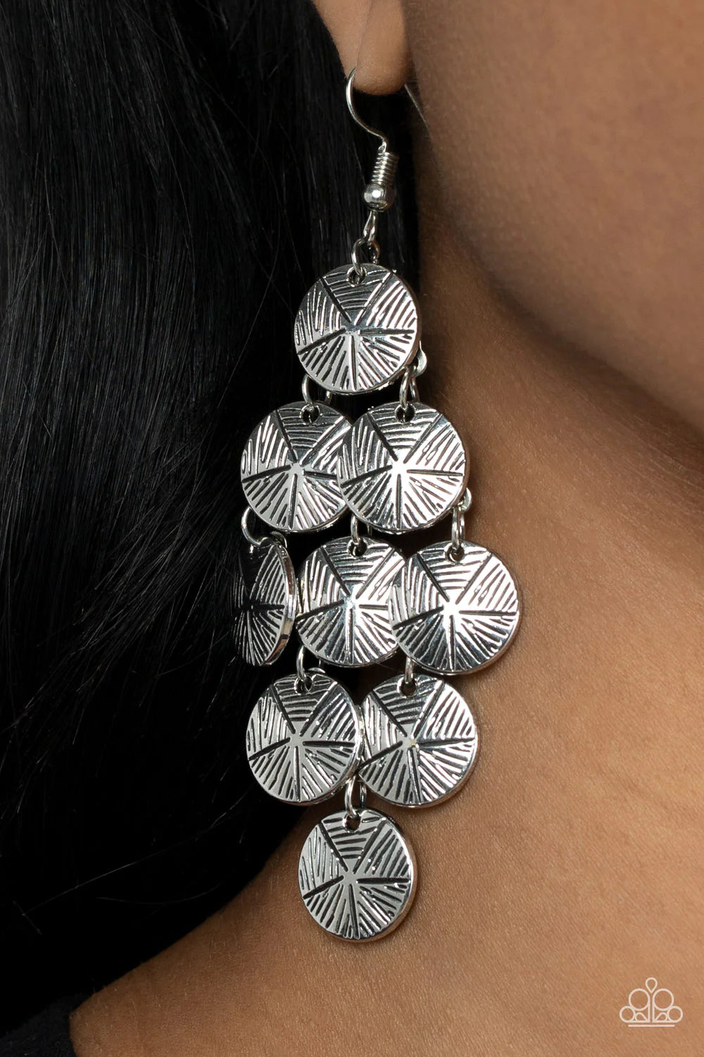 Paparazzi Accessories How CHIME Flies - Silver Etched in linear textures, star stamped silver discs cascade from a netted backdrop, creating a noisemaking lure. Earring attaches to a standard fishhook fitting. Sold as one pair of earrings. Jewelry