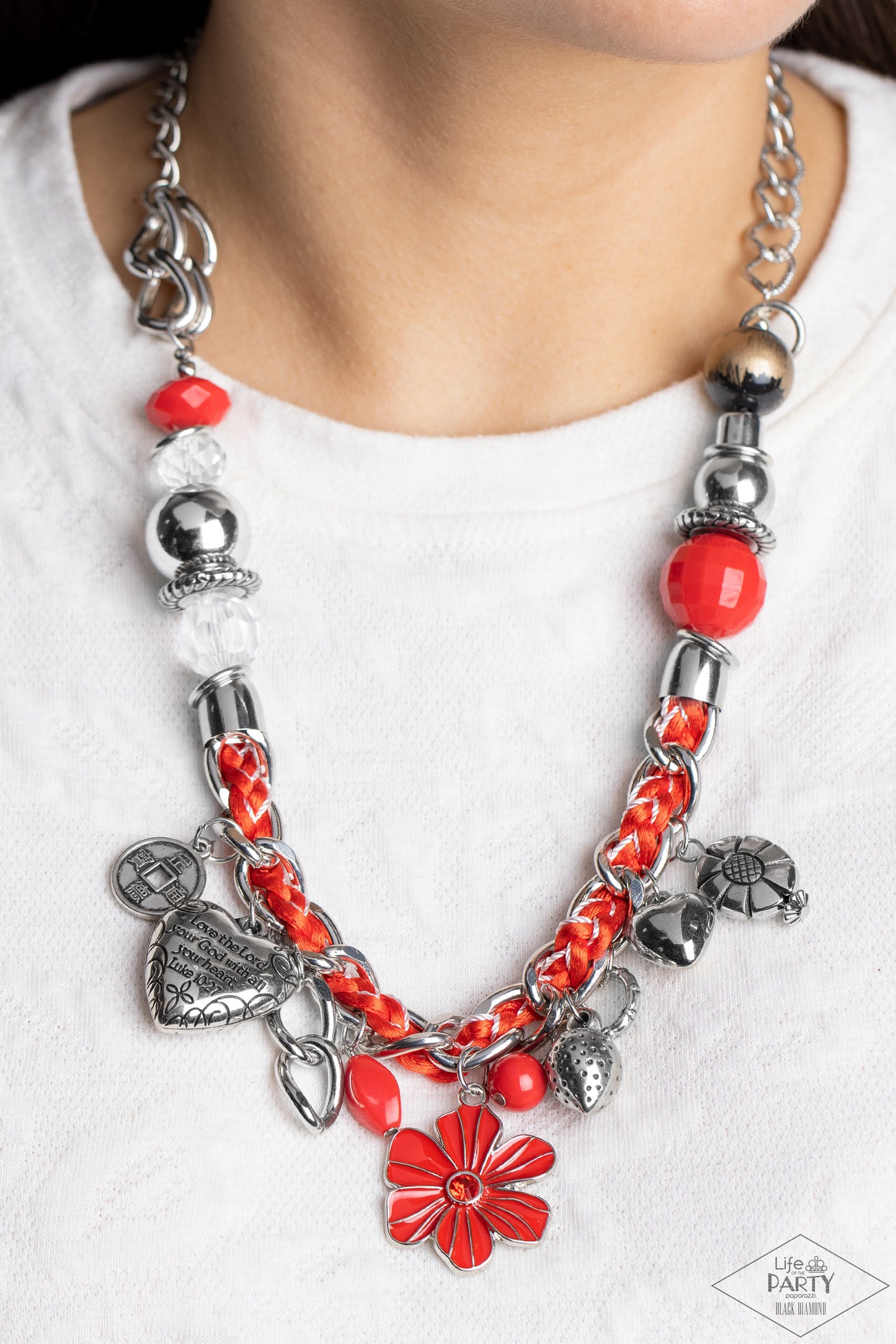 Paparazzi Accessories Charmed, I Am Sure - Red Red and ivory cording is braided through a chunky silver chain. A unique variety of charms decorate the piece including a delicate flower and a heart inscribed with the phrase "With All My Heart" on one side