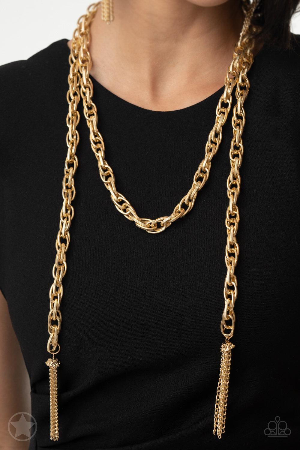 Paparazzi Accessories SCARFed for Attention - Gold A single strand of spiraling, interlocking links with light-catching texture is anchored by two tassels of chain that add dramatic length to the piece. Undeniably the most versatile piece in Paparazzi's h