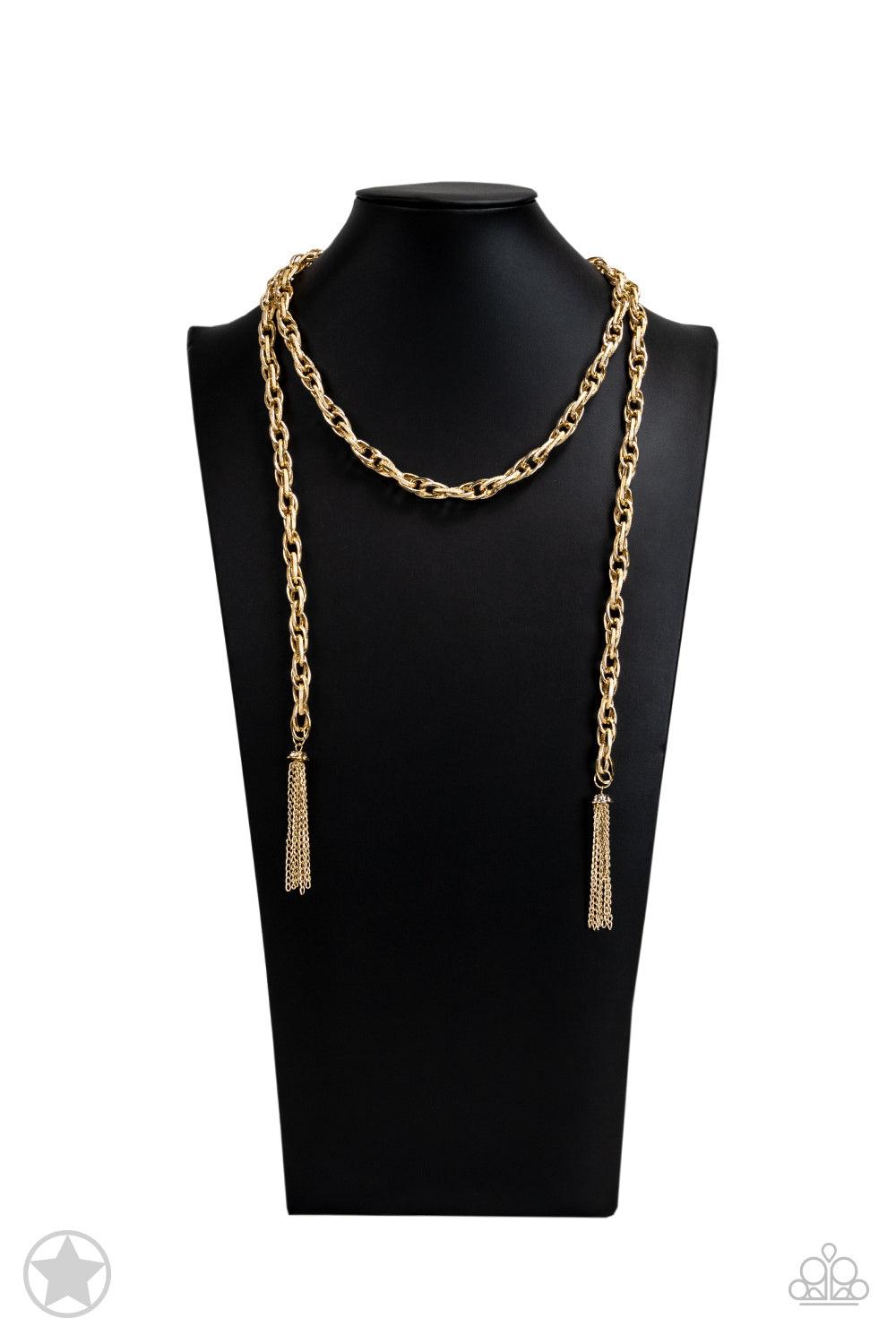 Paparazzi Accessories SCARFed for Attention - Gold A single strand of spiraling, interlocking links with light-catching texture is anchored by two tassels of chain that add dramatic length to the piece. Undeniably the most versatile piece in Paparazzi's h