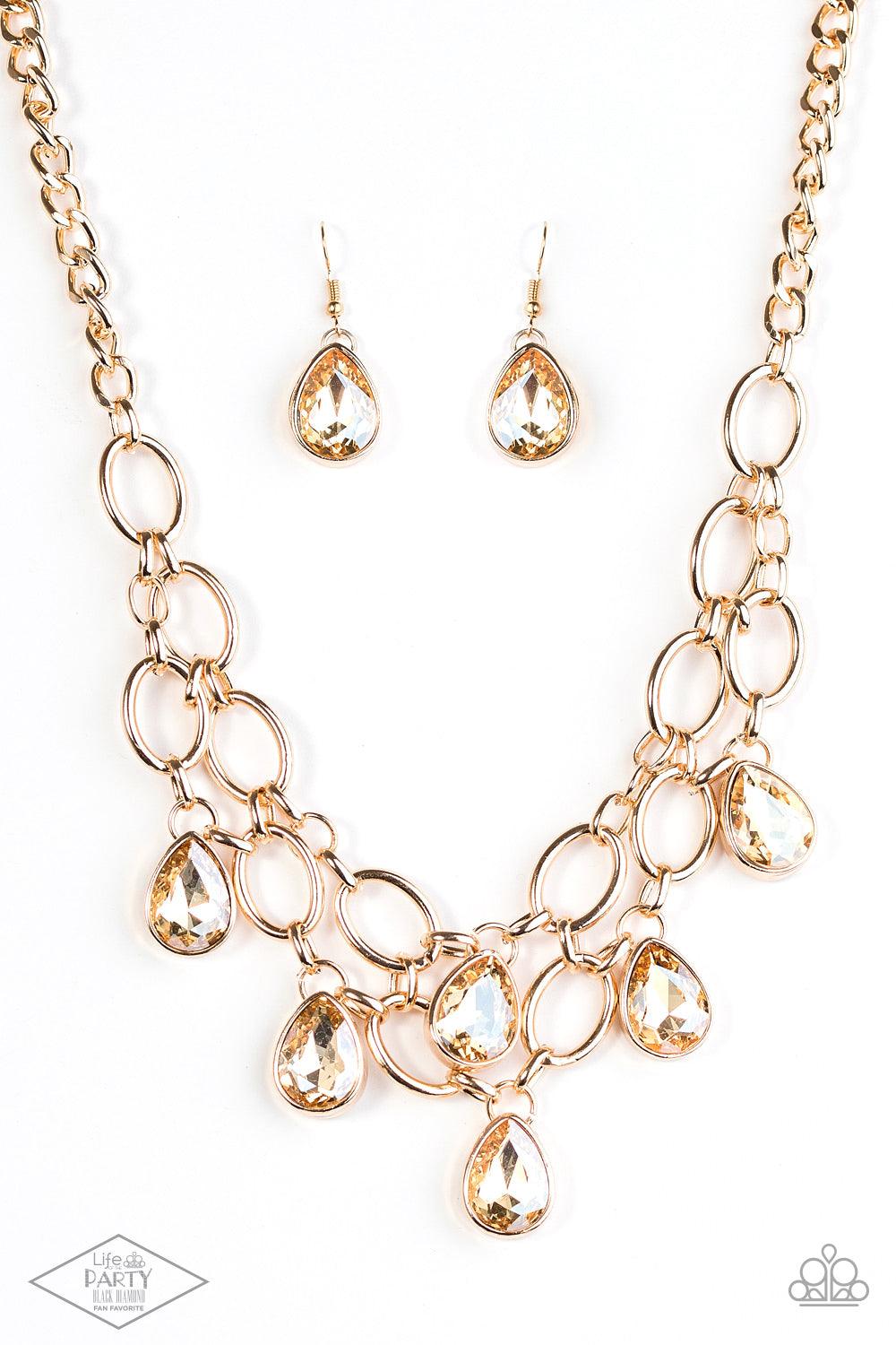 Paparazzi Accessories Show-Stopping Shimmer - Gold Joined by dainty gold links, two rows of dramatic gold chain layer below the collar in a fierce fashion. Golden teardrops drip from the glistening layers, adding a timeless shimmer to the show-stopping pi