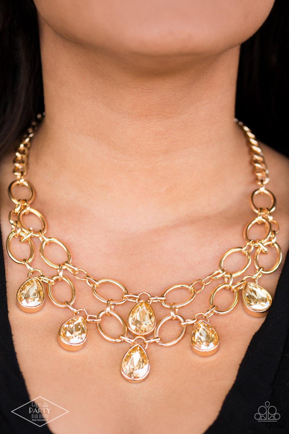 Paparazzi Accessories Show-Stopping Shimmer - Gold Joined by dainty gold links, two rows of dramatic gold chain layer below the collar in a fierce fashion. Golden teardrops drip from the glistening layers, adding a timeless shimmer to the show-stopping pi