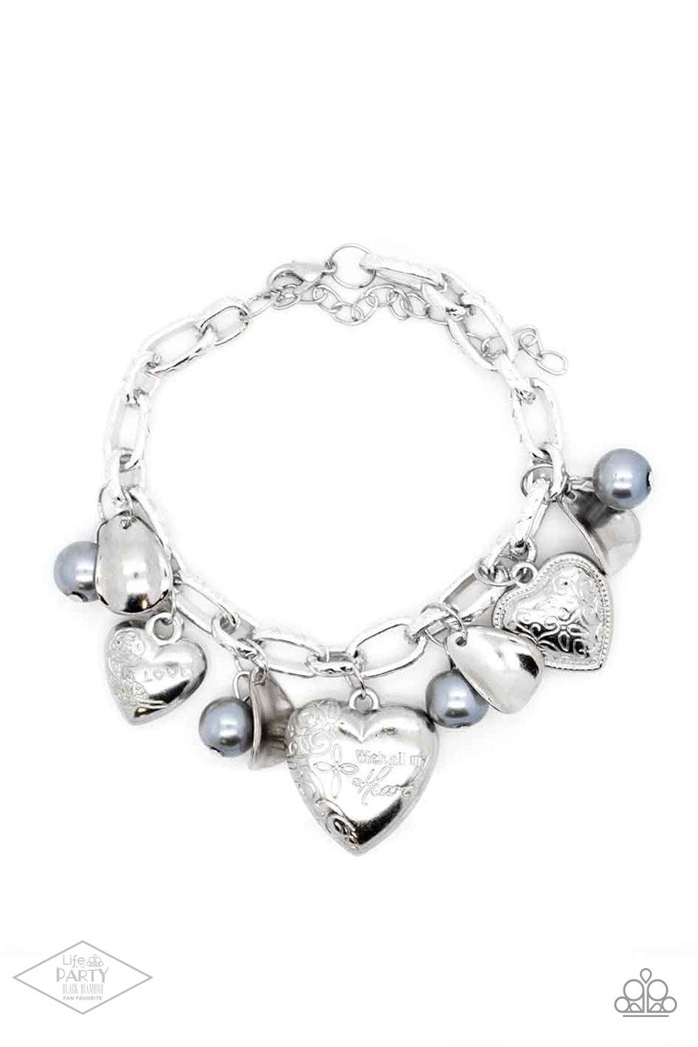 Paparazzi Accessories Love Will Find A Way -Silver Oversized silver links are adorned with curved silver discs, pearly gray beads, and an assortment of heart charms. One heart is etched with floral designs and the word, “Love,” another is swirled with fil