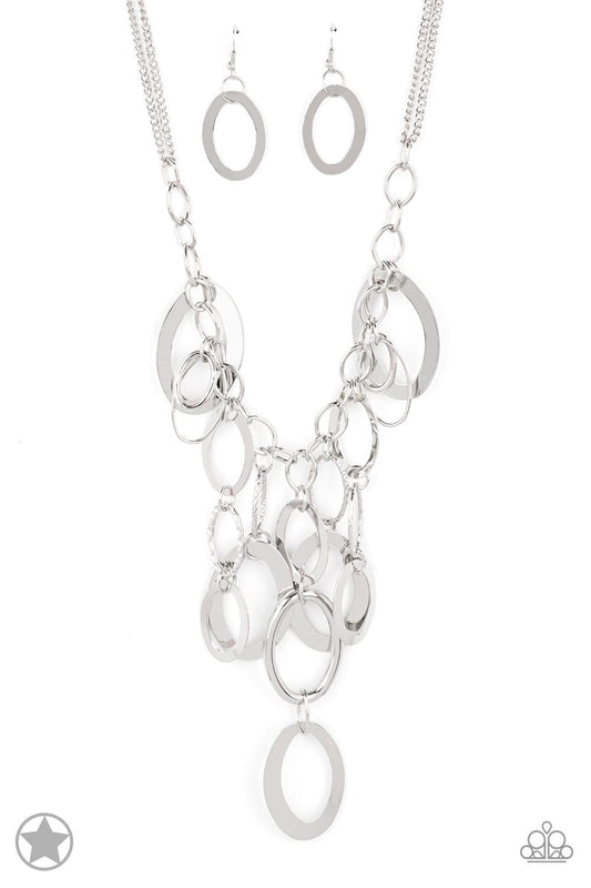 Paparazzi Accessories A Silver Spell Large silver links and shimmering textured silver rings cascade below a silver chain freely, allowing for movement that makes a bold statement. Features an adjustable clasp closure. Sold as one individual necklace.Incl