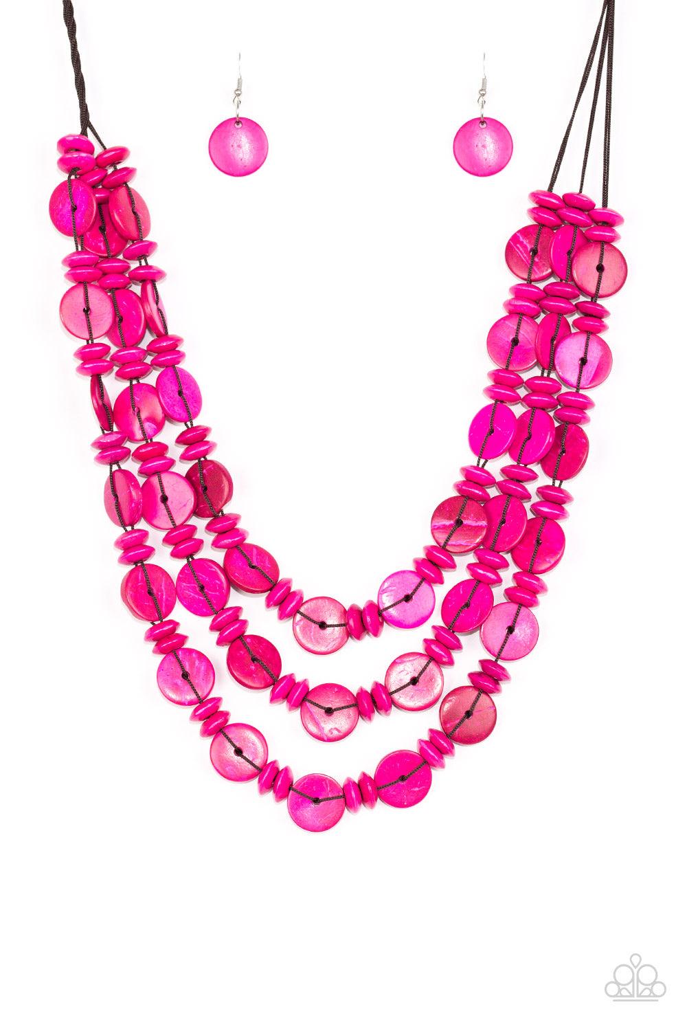 Paparazzi Accessories Barbados Bopper - Pink Brushed in a colorful finish, rows of vivacious pink wooden beads and discs are threaded along shiny brown cording for a summery look. Features a button loop closure. Sold as one individual necklace. Includes o