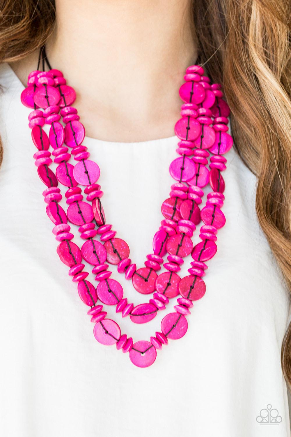 Paparazzi Accessories Barbados Bopper - Pink Brushed in a colorful finish, rows of vivacious pink wooden beads and discs are threaded along shiny brown cording for a summery look. Features a button loop closure. Sold as one individual necklace. Includes o