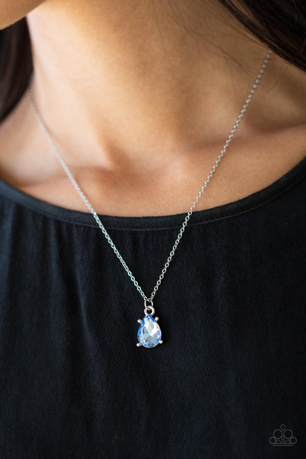 Paparazzi Accessories Classy Classicist - Blue Featuring a regal teardrop cut, a radiant blue gem swings from the bottom of a dainty silver chain, creating a timeless pendant below the collar. Features an adjustable clasp closure. Sold as one individual n