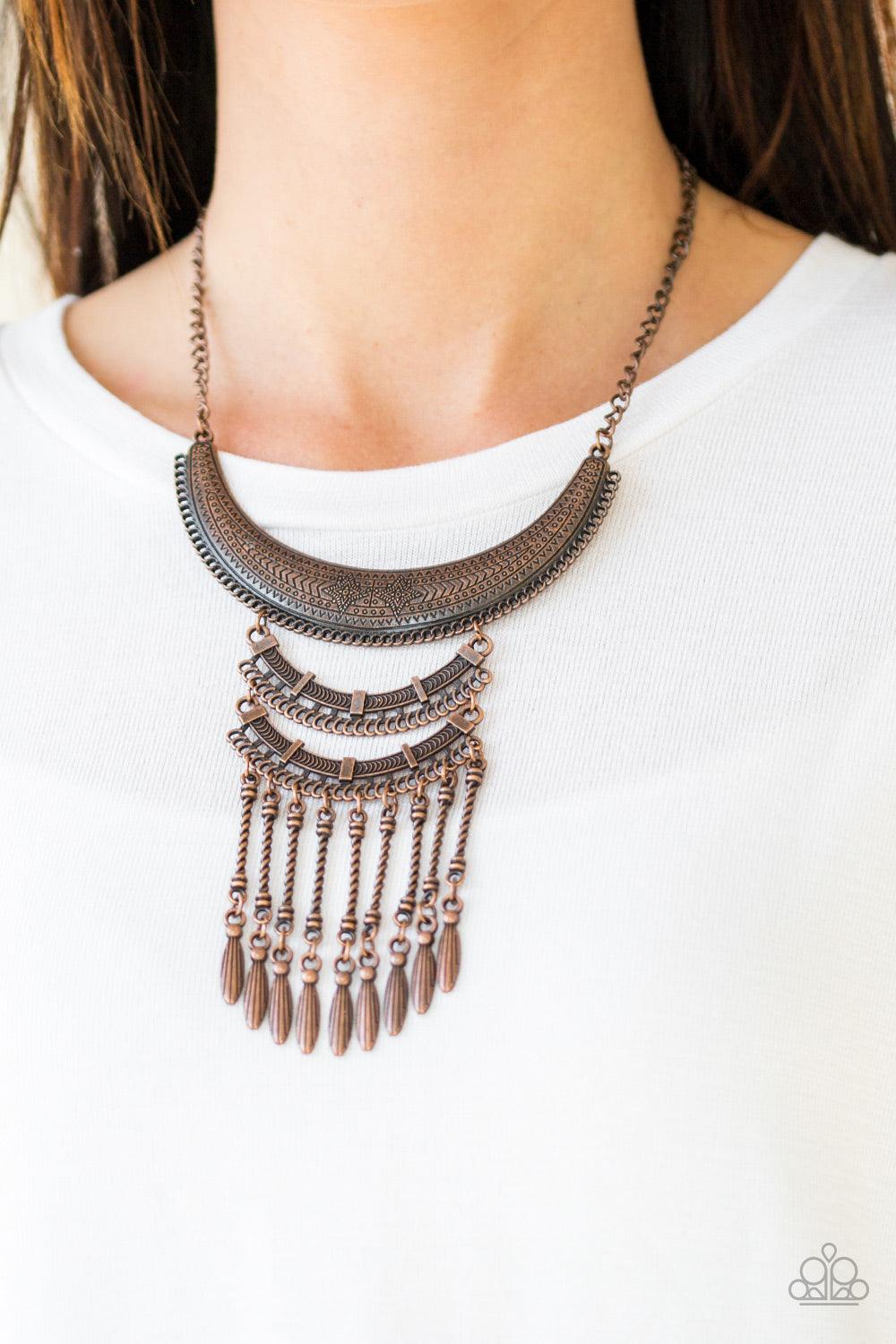 Paparazzi Accessories Eastern Empress - Copper Stamped and embossed in tribal inspired patterns, three copper plates connect down the chest, creating a fiercely stacked pendant. Attached to twisted copper rods, ornate copper beads swing from the bottom of