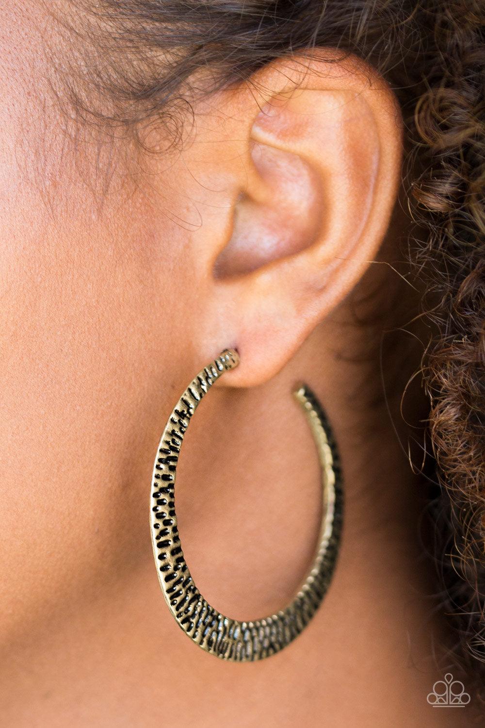 Paparazzi Accessories BEAST Friends Forever - Brass Delicately hammered in shimmery textures, a glistening brass hoop curls around the ear for a fierce fashion. Earring attaches to a standard post fitting. Hoop measures 2" in diameter. Sold as one pair of