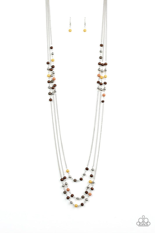 Paparazzi Accessories Seasonal Sensation - Multi Dainty brown, Aspen Gold, Terrarium Moss, and wooden beads trickle along three shimmery silver chains, creating colorful layers across the chest. Features an adjustable clasp closure. Sold as one individual