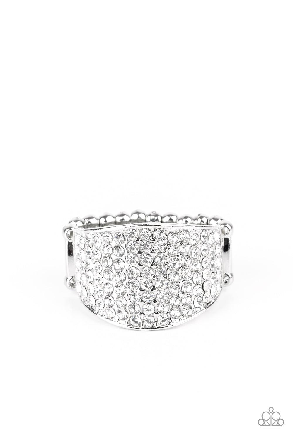 Paparazzi Accessories Kaboom! - White Countless white rhinestones are encrusted along a thick silver band for a spellbinding look. Features a stretchy band for a flexible fit. Sold as one individual ring. Jewelry