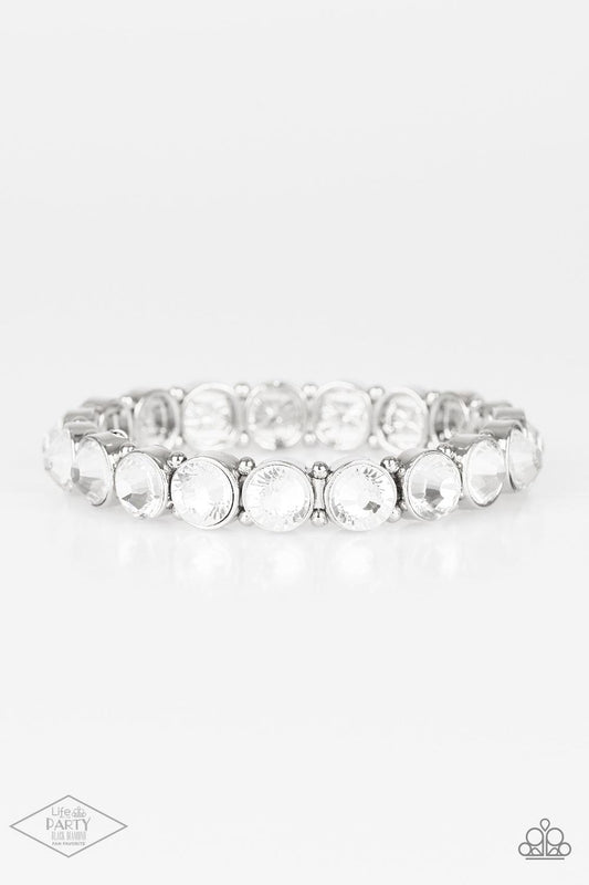Paparazzi Accessories Sugar-Coated Sparkle - White Infused with dainty silver beads, glassy white rhinestone encrusted frames are threaded along stretchy bands around the wrist for a glamorous look. Sold as one individual bracelet. This Fan Favorite is ba