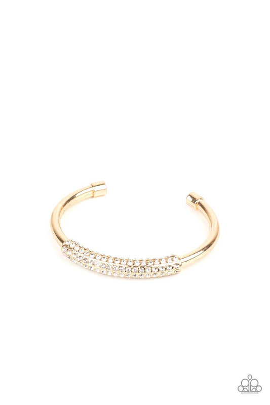 Paparazzi Accessories Day to Day Dazzle - Gold The center of a thick bangle-like cuff is decorated in a sleek gold frame encrusted in row after row of glassy white rhinestones for a refined flair. Sold as one individual bracelet. Jewelry