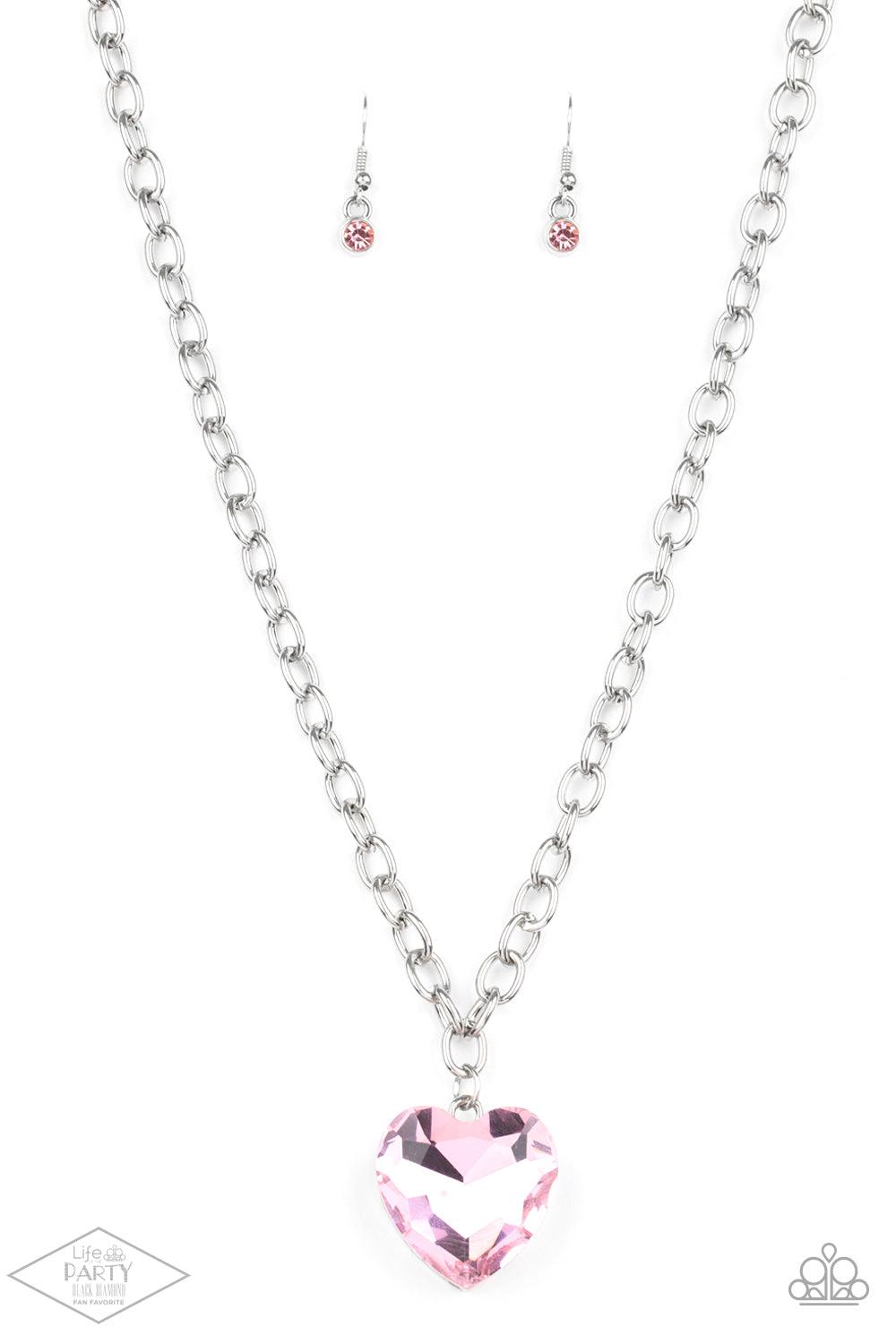 Paparazzi Accessories Flirtatiously Flashy - Pink Set atop a sleek silver fitting, a glittery pink heart-shaped gem swings from the bottom of a classic silver chain below the collar for a whimsical look. Features an adjustable clasp closure. Sold as one i
