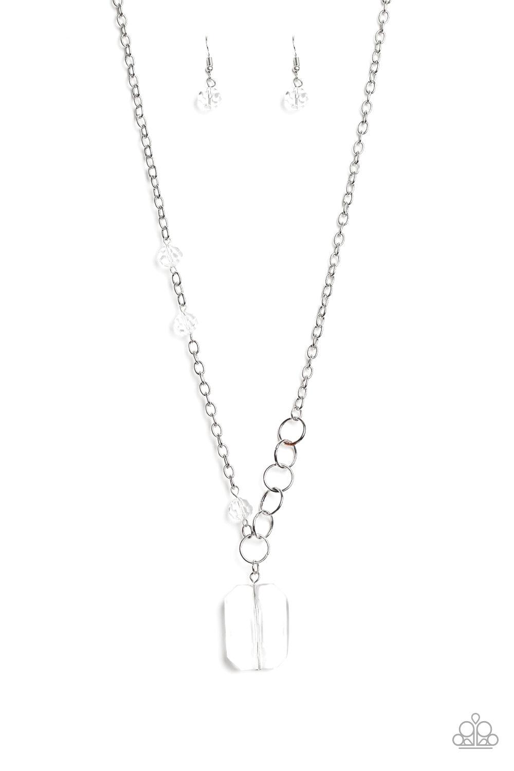 Paparazzi Accessories Never a Dull Moment - White A trio of glassy white crystal-like beads asymmetrically trickle along a mismatched silver chain. Featuring a regal emerald-cut, an oversized white gem swings from the bottom of the silver chain for a glam