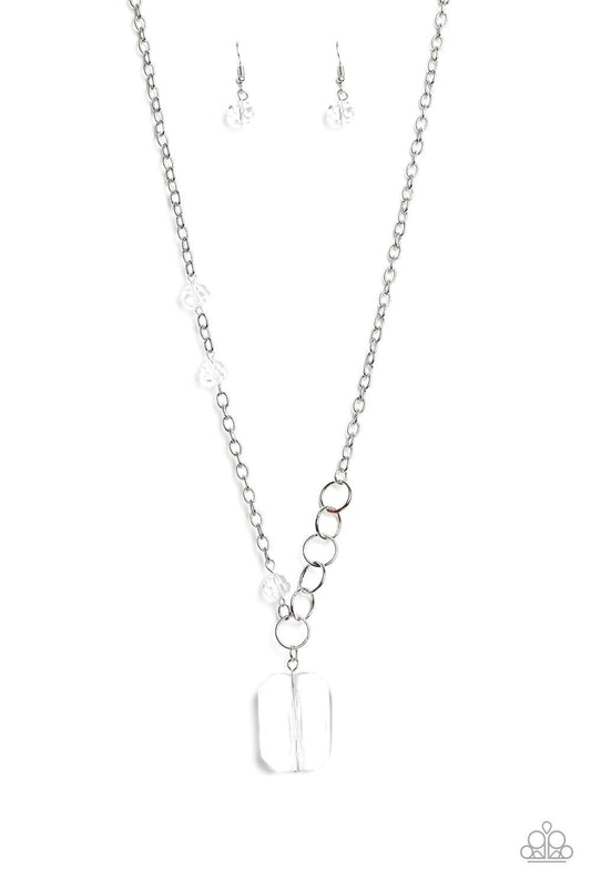 Paparazzi Accessories Never a Dull Moment - White A trio of glassy white crystal-like beads asymmetrically trickle along a mismatched silver chain. Featuring a regal emerald-cut, an oversized white gem swings from the bottom of the silver chain for a glam