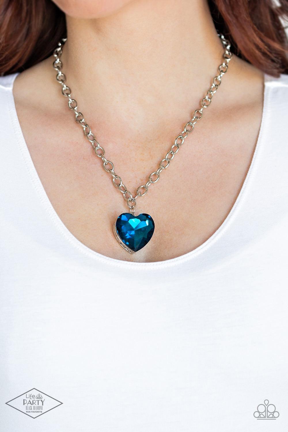 Paparazzi Accessories Flirtatiously Flashy - Blue Set atop a sleek silver fitting, a glittery blue heart-shaped gem swings from the bottom of a classic silver chain below the collar for a whimsical look. Features an adjustable clasp closure. Sold as one i