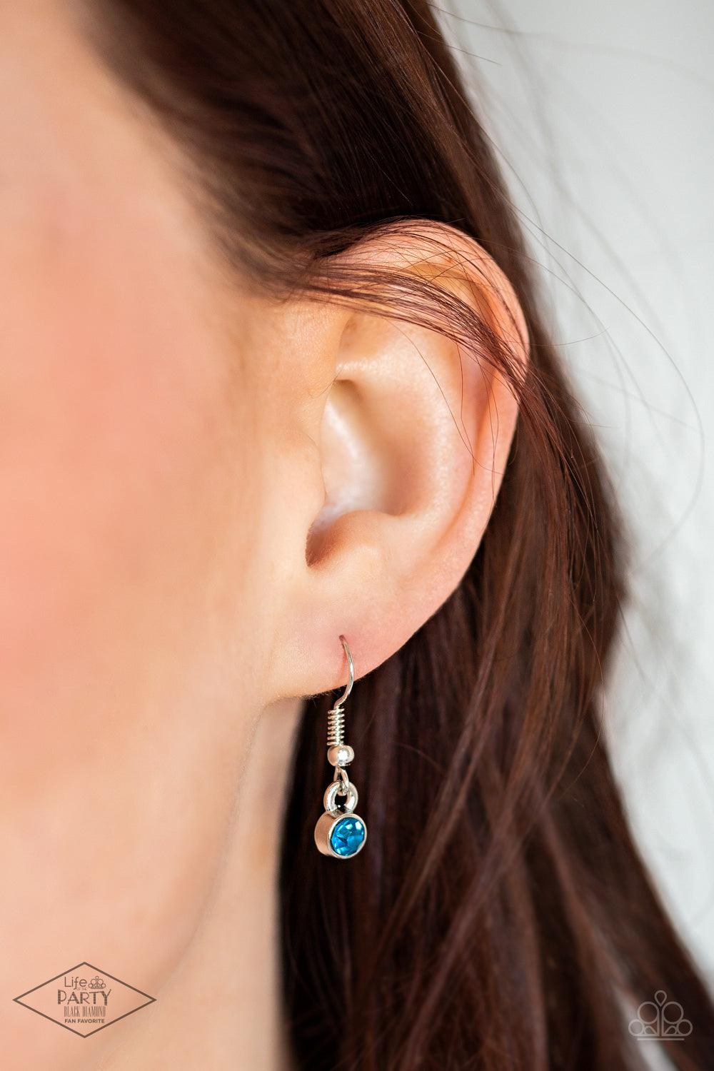 Paparazzi Accessories Flirtatiously Flashy - Blue Set atop a sleek silver fitting, a glittery blue heart-shaped gem swings from the bottom of a classic silver chain below the collar for a whimsical look. Features an adjustable clasp closure. Sold as one i