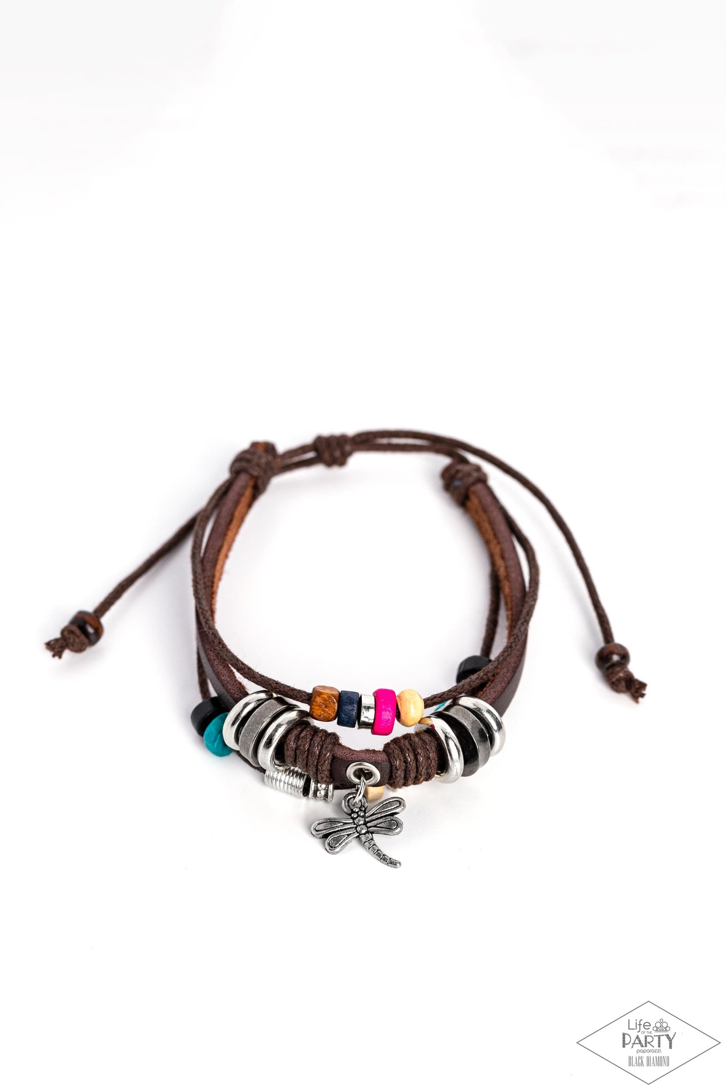 Paparazzi Accessories Fly High, Dragonfly - Brown Featuring colorful wooden beads, shiny metallic accents, and a shimmery dragonfly charm, mismatched strands of brown cording and leather layer across the wrist for a whimsical fashion. Features an adjustab