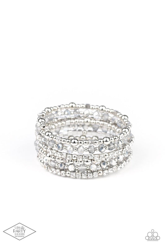 Paparazzi Accessories ICE Knowing You - Silver An icy collection of silver beads, silver cubes, metallic crystals, and glassy white rhinestones are threaded along a coiled wire, creating a blinding infinity wrap style bracelet around the wrist. Sold as on