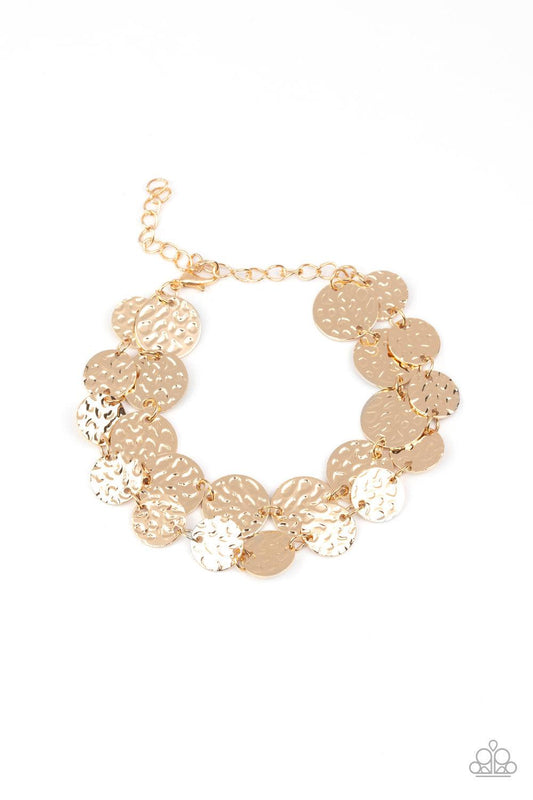 Paparazzi Accessories Rooted To The SPOTLIGHT - Gold Two rows of hammered gold discs wrap around the wrist, creating an edgy shimmer. Features an adjustable clasp closure. Sold as one individual bracelet. Get The Complete Look! Necklace: "Spotlight Ready