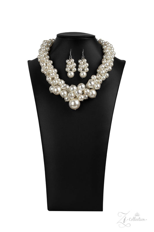 Paparazzi Accessories Regal 💗💗ZiCollection $25💗💗 An exaggerated display of clustered pearls elegantly sweeps below the collar. The classic white pearls gradually increase in bubbly intensity as they reach the center of the regal piece, adding over-the