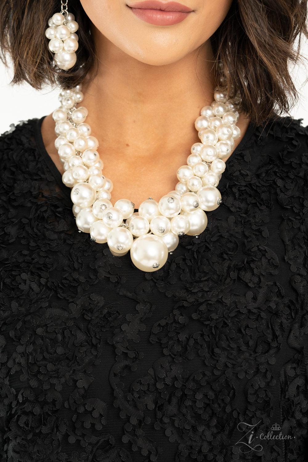 Paparazzi Accessories Regal 💗💗ZiCollection $25💗💗 An exaggerated display of clustered pearls elegantly sweeps below the collar. The classic white pearls gradually increase in bubbly intensity as they reach the center of the regal piece, adding over-the