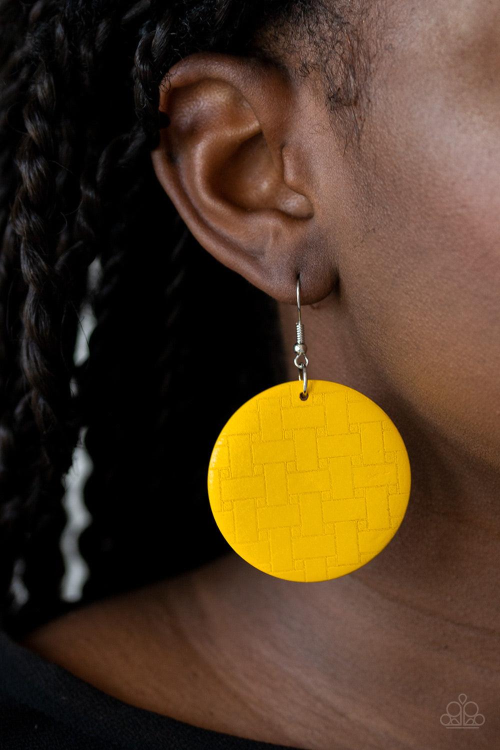 Paparazzi Accessories Natural Novelty - Yellow Engraved in a woven geometric pattern, an earthy yellow wooden disc swings from the ear for a natural-inspired look. Earring attaches to a standard fishhook fitting. Sold as one pair of earrings. Jewelry