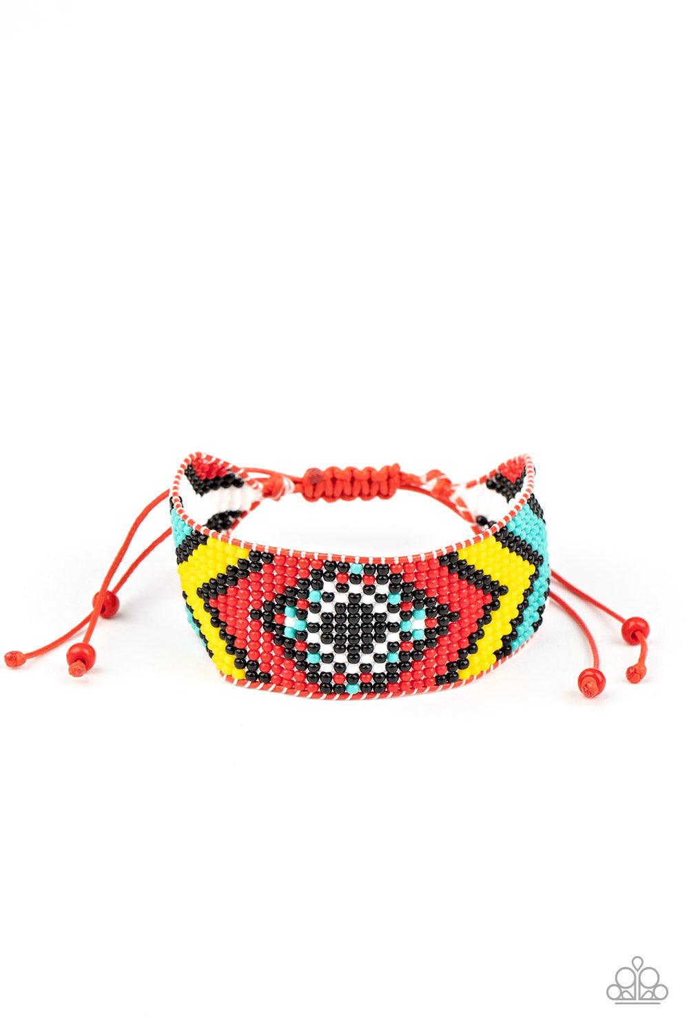 Paparazzi Accessories Desert Dive - Red A dainty collection of red, black, yellow, white, and turquoise beads are delicately weaved into a colorful textile pattern across the wrist for a southwestern inspired fashion. Features an adjustable sliding knot c