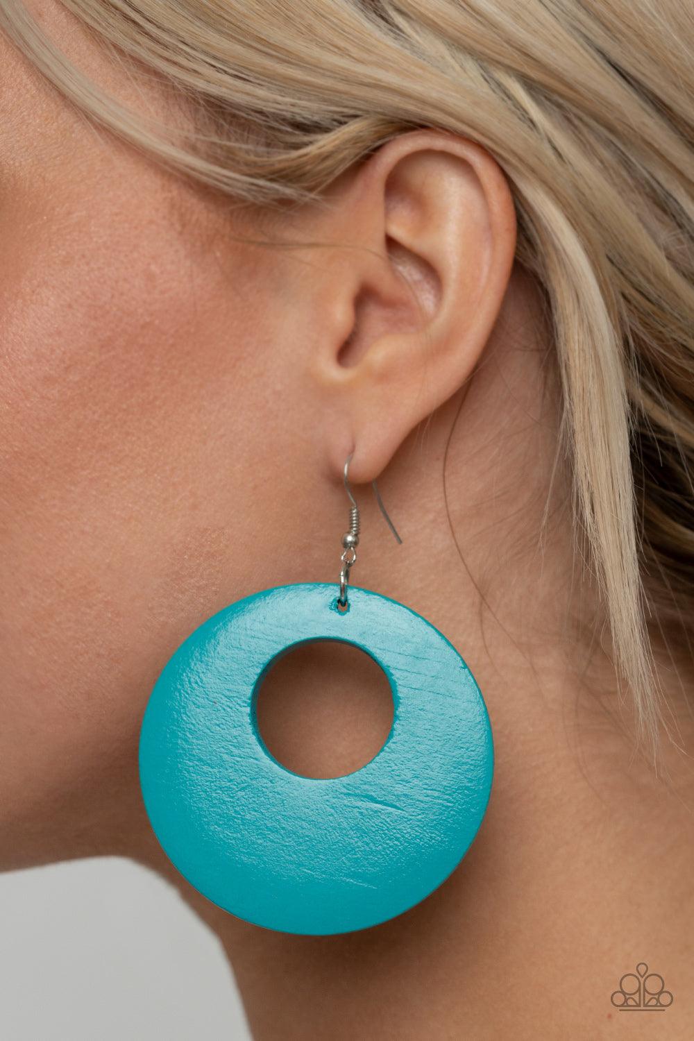 Paparazzi Accessories Island Hop - Blue Painted in a refreshing blue hue, an oversized wooden hoop-like frame swings from the ear for a colorful look. Earring attaches to a standard fishhook fitting. Sold as one pair of earrings. Jewelry
